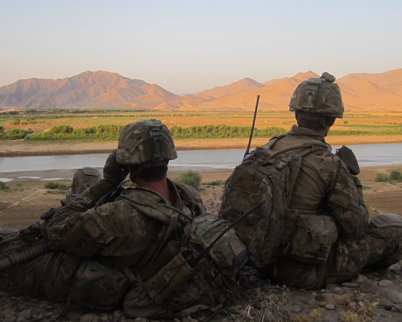 Soldiers overlooking mountain range.
